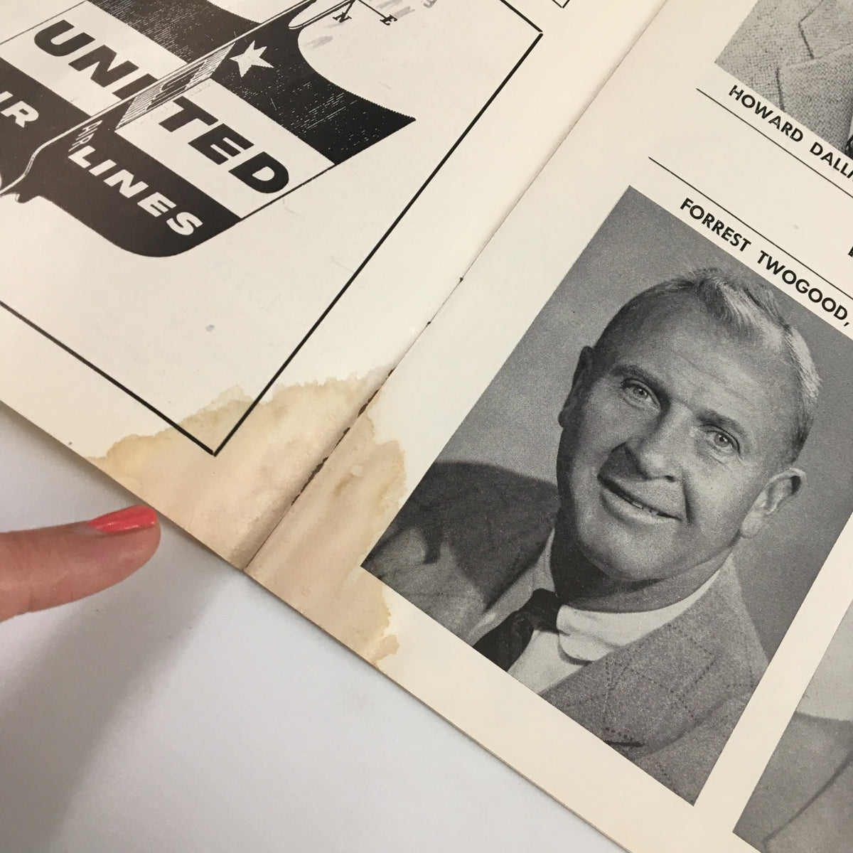 February 22, 1958 NCAA Basketball Oregon State vs UCLA Official Program showing a page with a water stain and a photo of a coach.