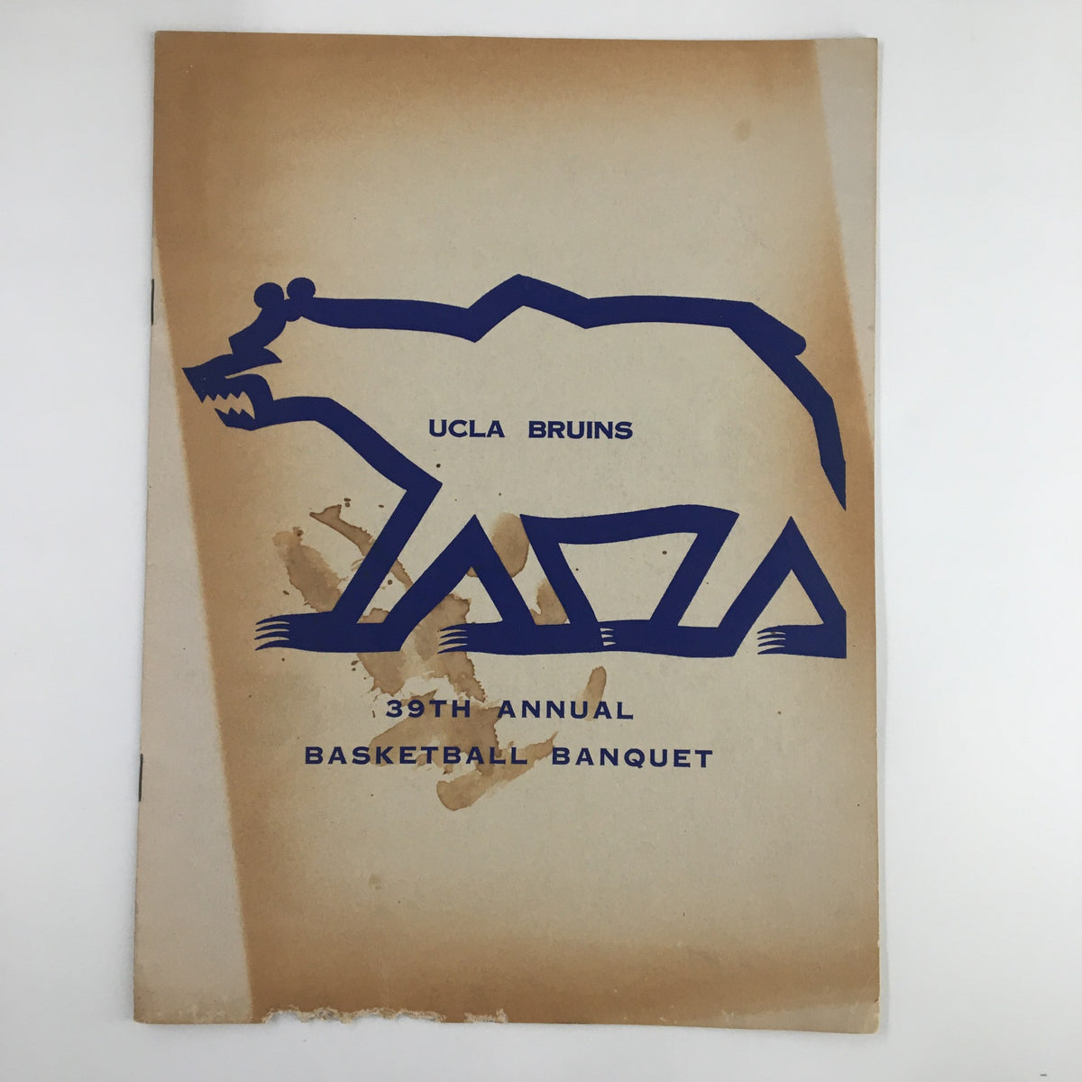 Cover of the March 12, 1958 NCAA Basketball UCLA Bruins 39th Annual Basketball Banquet magazine featuring a stylized bear logo and event details.