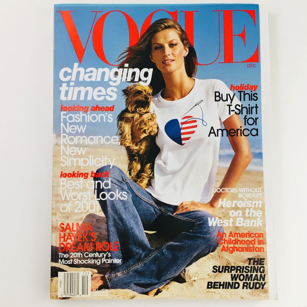 Vogue Magazine December 2001 featuring Brazilian model Gisele Bündchen on the cover, showcasing a fashion editorial with a dog and the phrase 'changing times'.