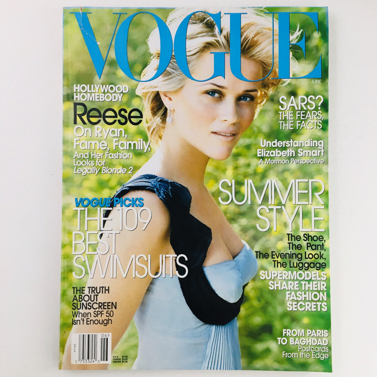 Vogue Magazine June 2003 cover featuring American actress Reese Witherspoon, showcasing fashion from the early 2000s with headlines on summer style and swimwear.