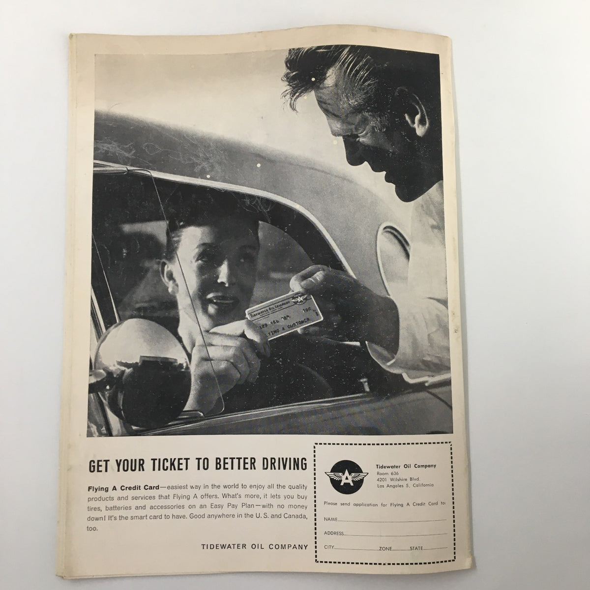 Vintage advertisement from the December 26 1962 NCAA St. Louis vs UCLA Basketball Classic program, promoting Tidewater Oil Company with an image of a man handing a card to a woman in a car.