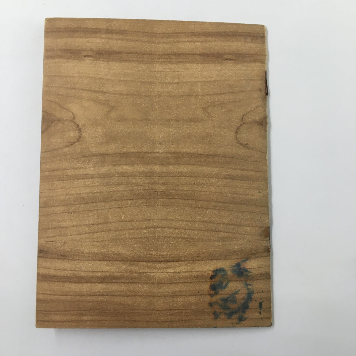 1950-1951 NCAA Basketball Long Island University Official Program back cover with wooden texture and minor imperfections indicative of vintage memorabilia.