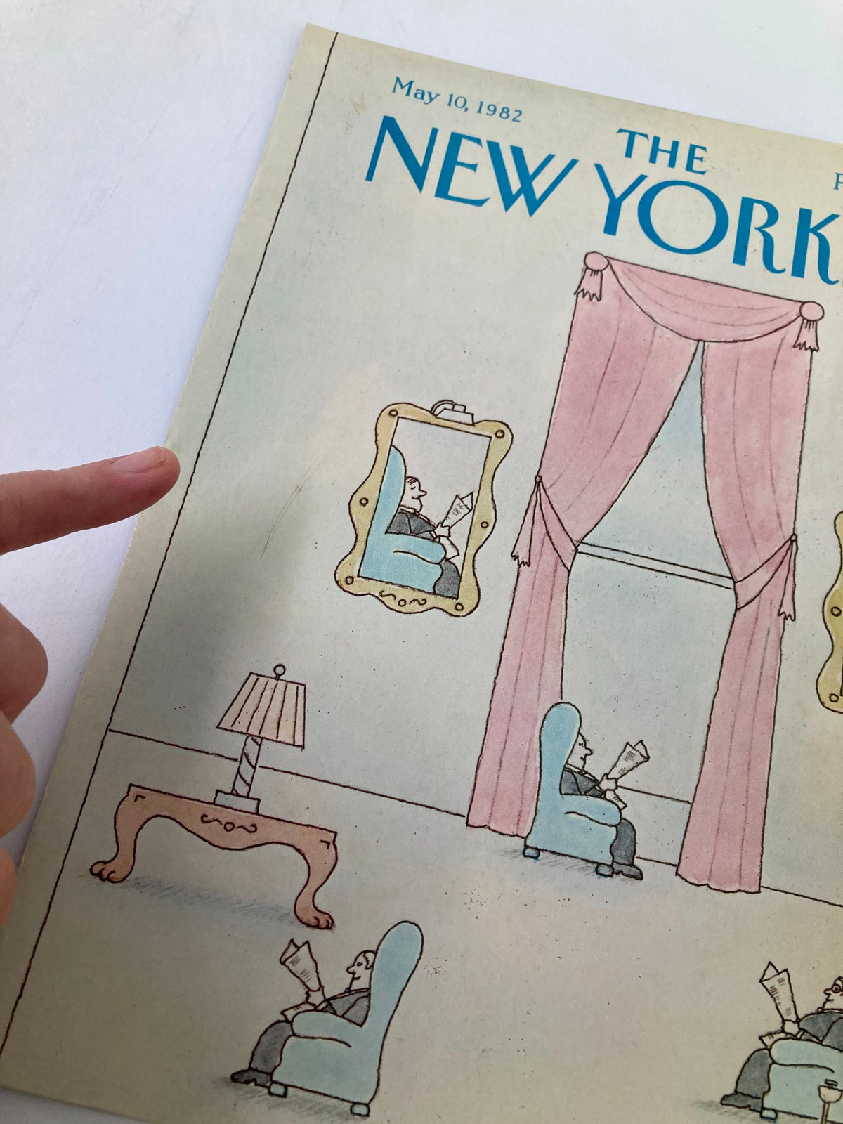 Detailed view of The New Yorker May 10 1982 cover by Robert Tallon highlighting businessmen in a room with decorative elements, including curtains and furniture, focusing on the artwork's intricate details.