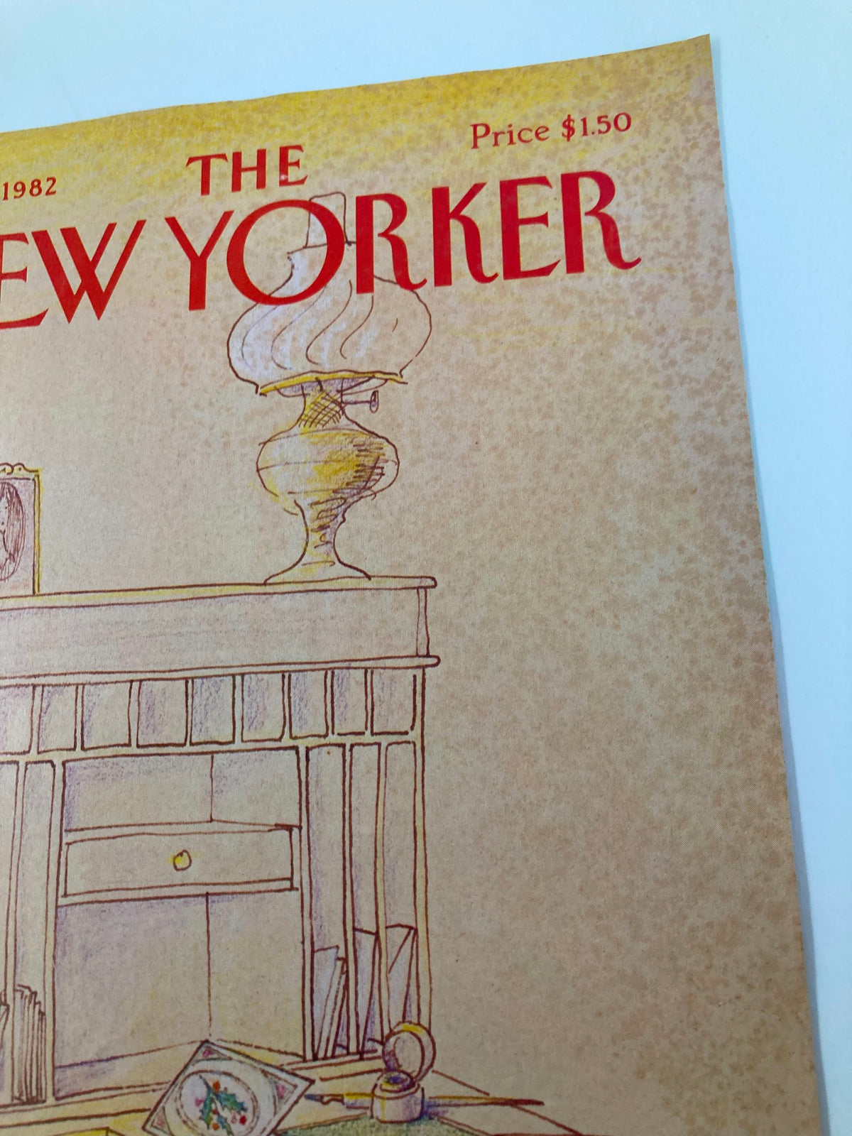 Close-up view of The New Yorker cover dated December 6, 1982, featuring Eugene Mihaesco's 'Old Desk' artwork, highlighting the lamp and decorative elements on the desk.