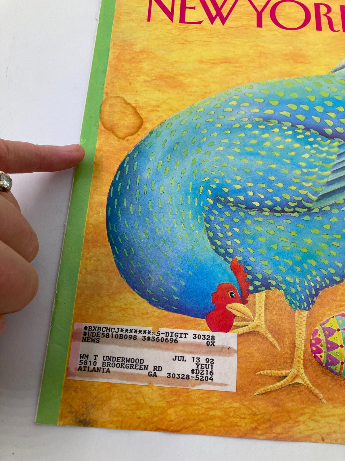 Closer view of The New Yorker cover from April 20, 1992, displaying the vibrant blue hen and Easter egg by Jenni Oliver, highlighting the condition and details of the magazine cover.