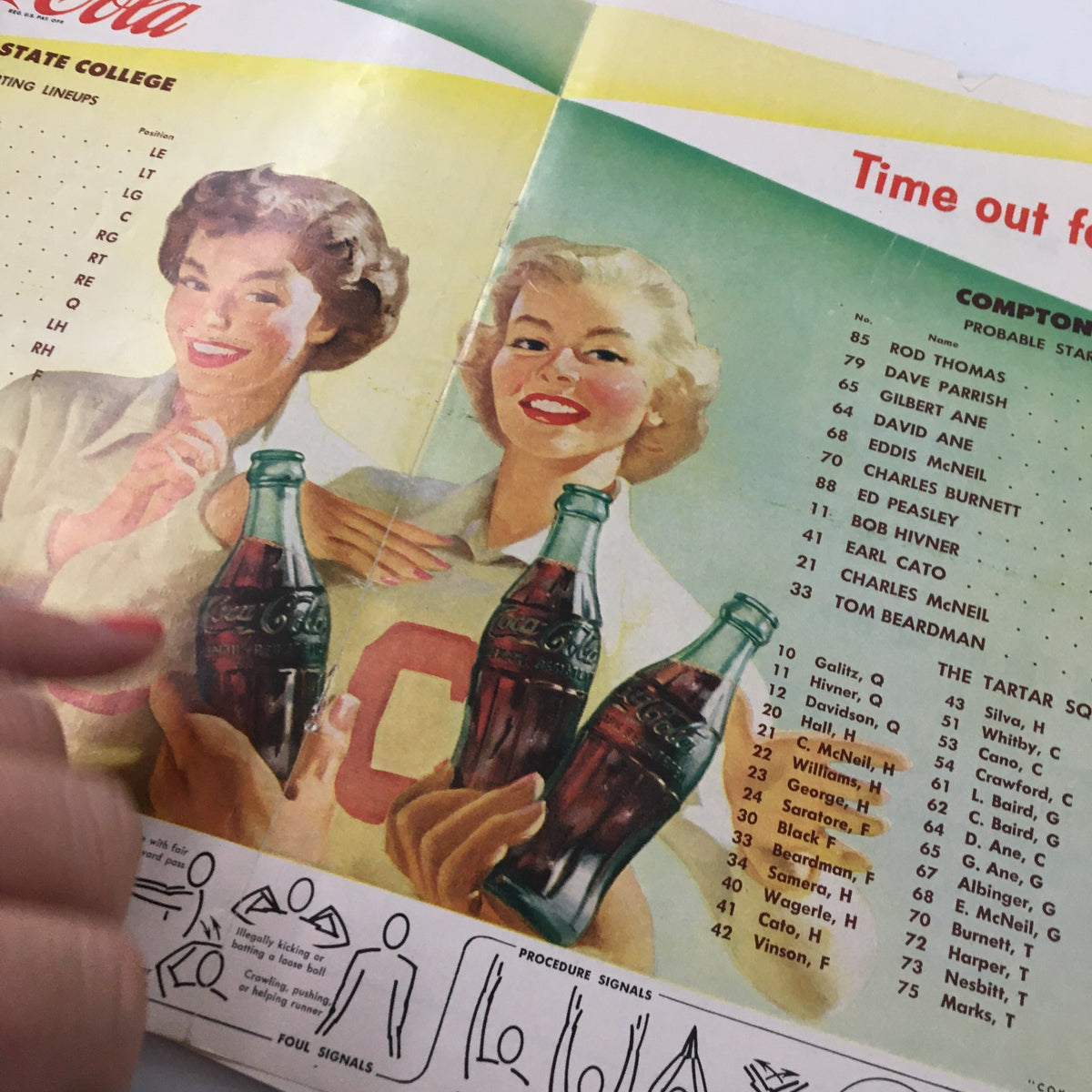 Advertisement for Coca-Cola showcasing two women in vintage attire, page from the December 8, 1956 NCAA Football Arlington vs Compton Junior Rose Bowl Game Program.