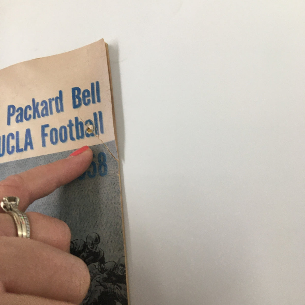 Close-up of the 1958 NCAA Packard Bell UCLA Bruins Football Official Program showing minor wear and a corner detail.
