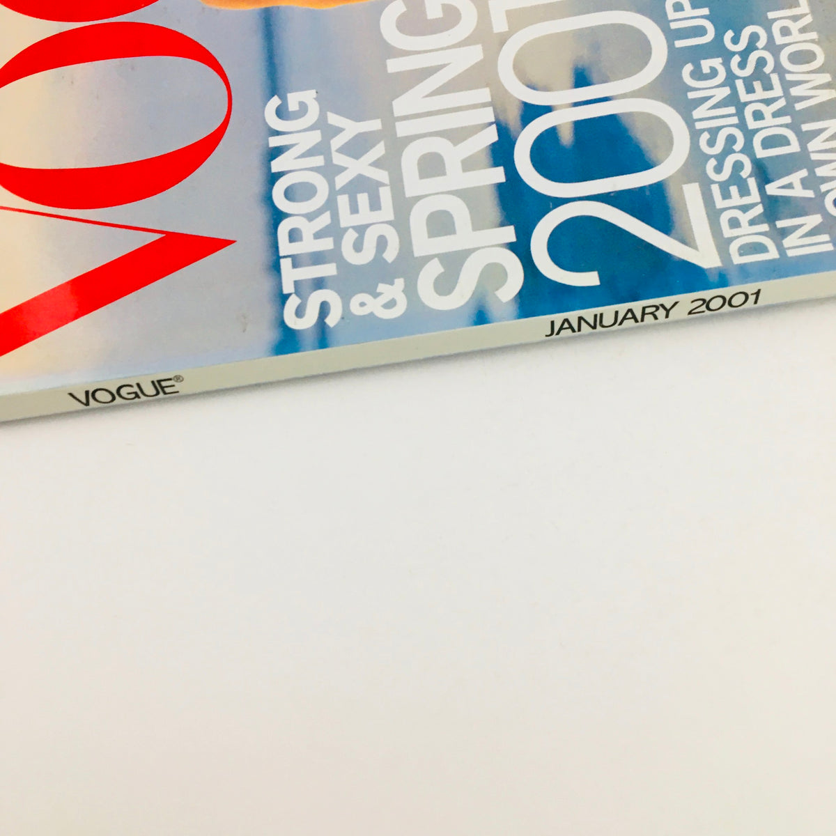 Close-up view of the spine of Vogue Magazine January 2001, highlighting the title and issue details, indicating a collectible edition featuring Marion Jones.