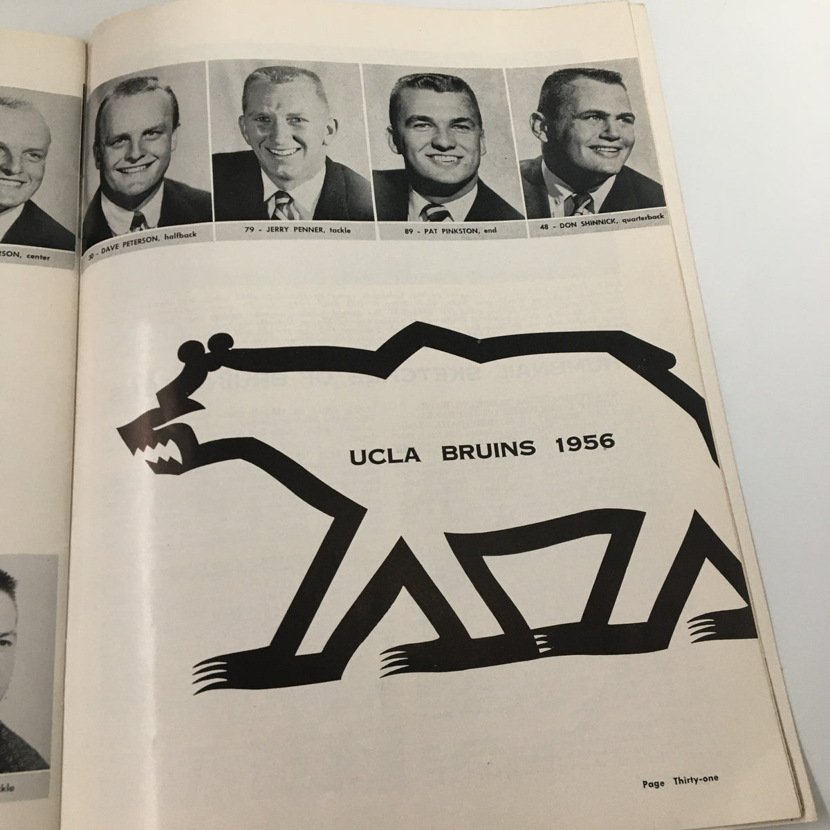 Final page of the 1956 UCLA Bruins The Goal Post Official Program showing player headshots and the signature UCLA bear logo.