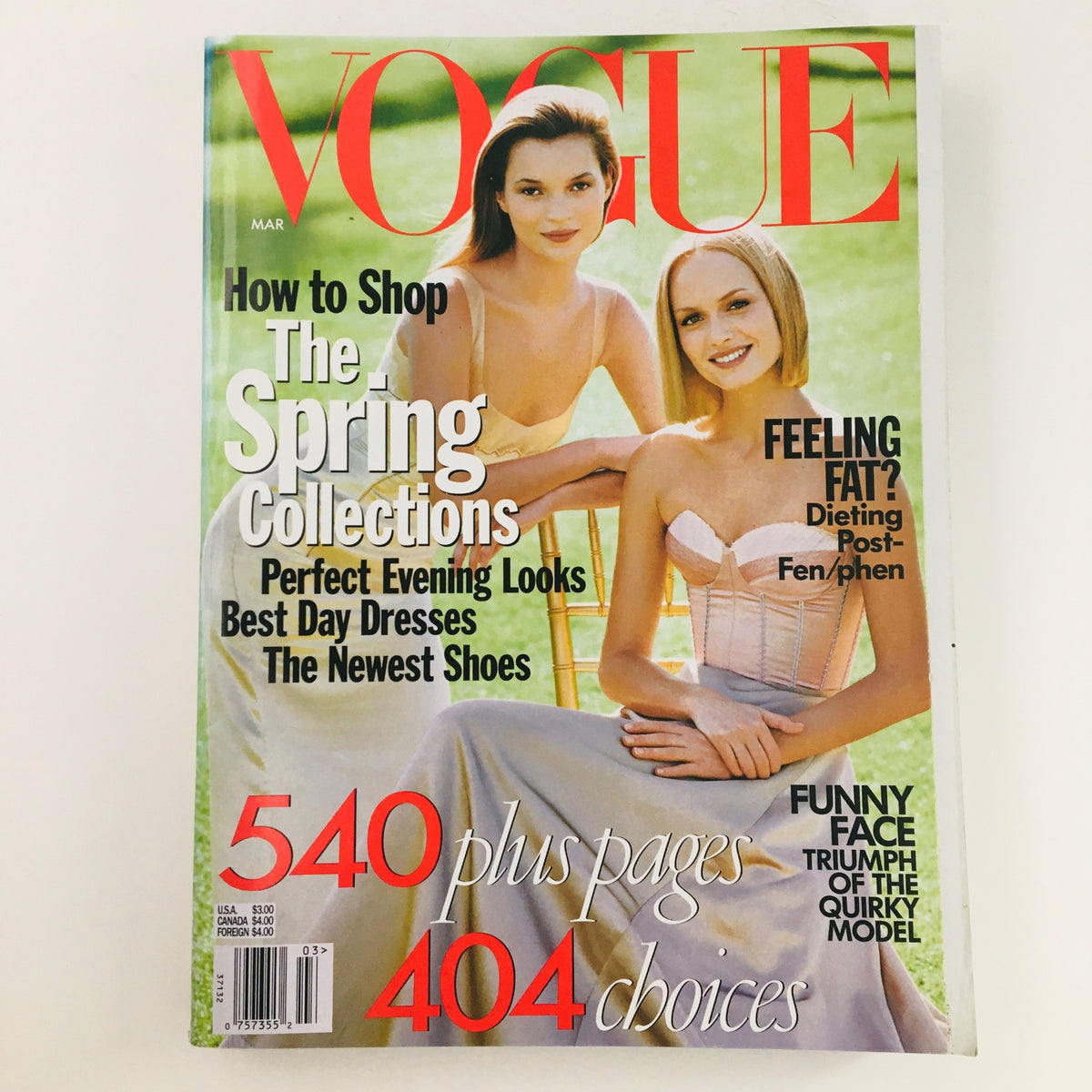 Vogue Magazine cover from March 1998 featuring Kate Moss and Amber Valletta, showcasing Spring Collections with a vibrant background.