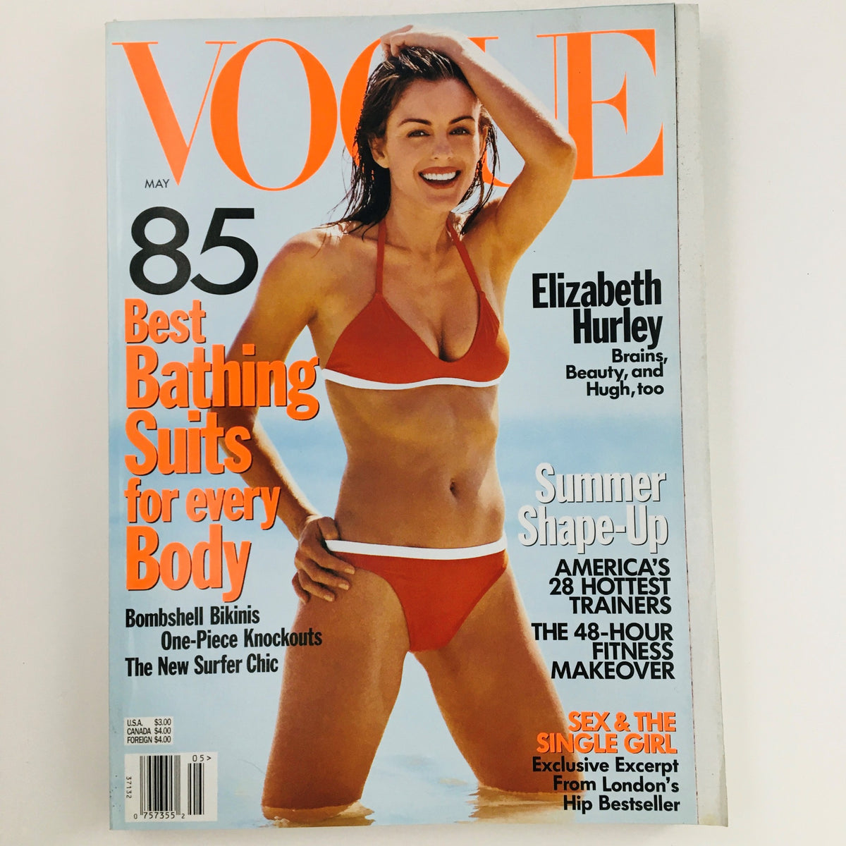 Vogue Magazine May 1998 featuring Elizabeth Hurley on the cover in a red bikini, showcasing the best bathing suits for every body, capturing the essence of 90s fashion.