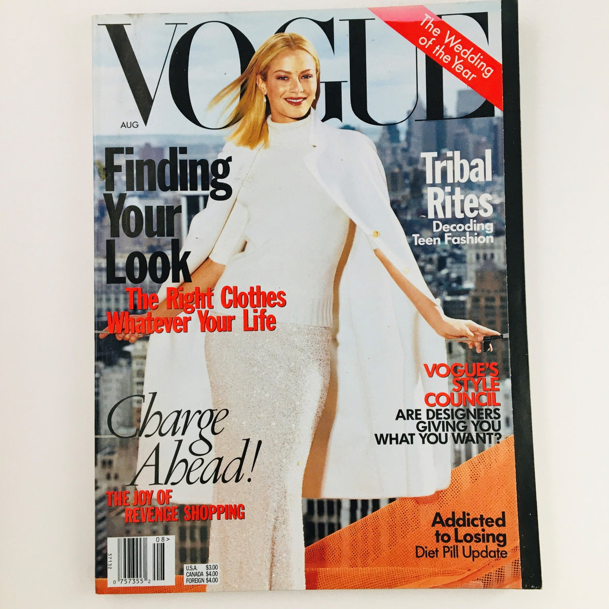 Vogue Magazine August 1998 cover featuring American model Carolyn Murphy, highlighting fashion trends with the text 'Finding Your Look' and 'The Wedding of the Year.' The magazine captures the vibrant spirit of the late '90s.