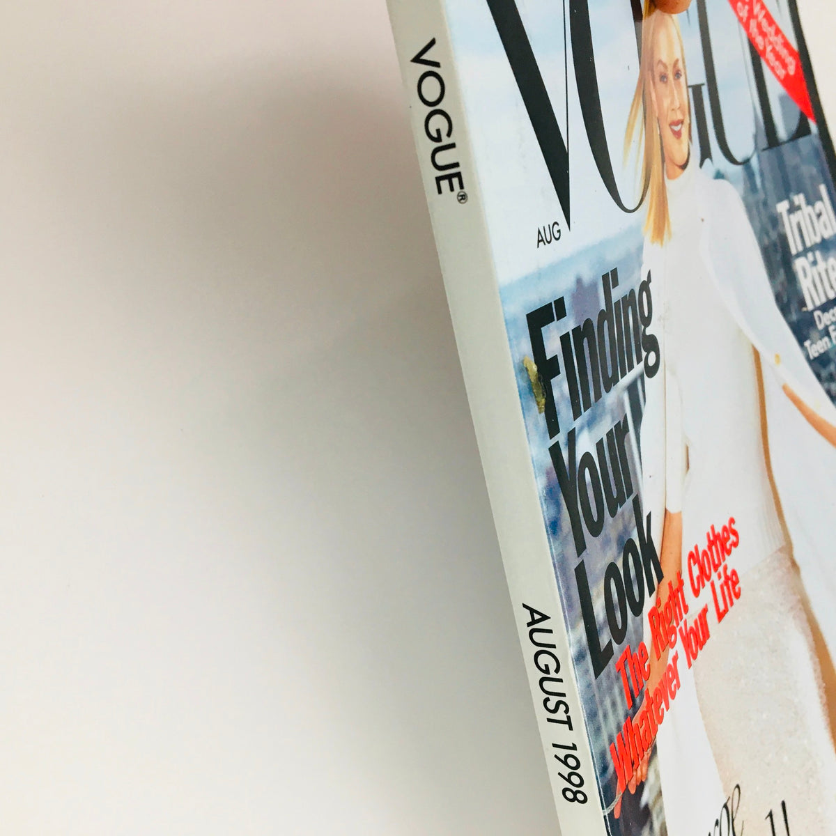 Vogue Magazine August 1998 showing the side view of the magazine, prominently displaying the title, month, and year along with the issue theme 'Finding Your Look' and other fashion highlights.