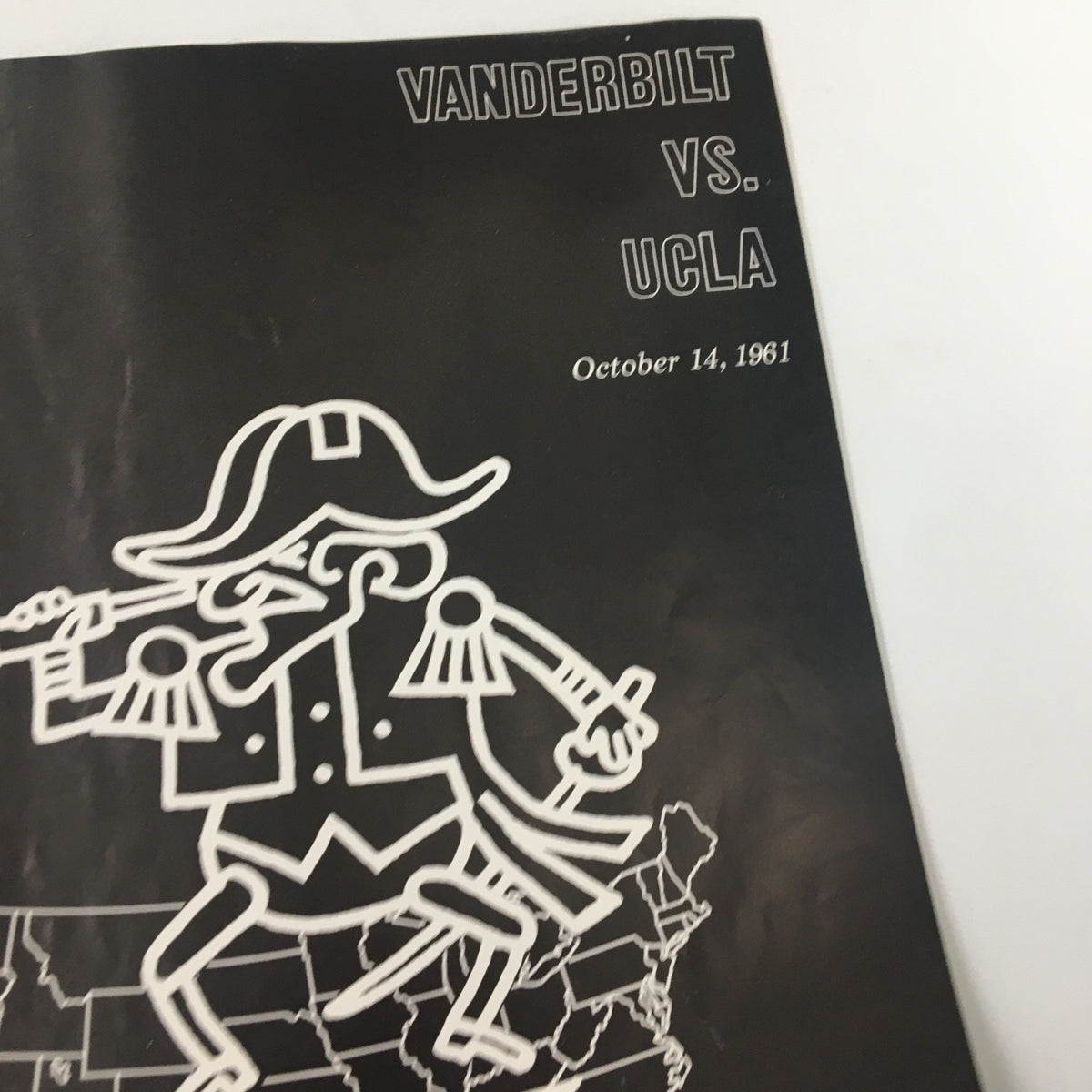 Vintage cover of the October 14 1961 NCAA Football Official Program featuring Vanderbilt vs UCLA, showcasing team graphics and game details.