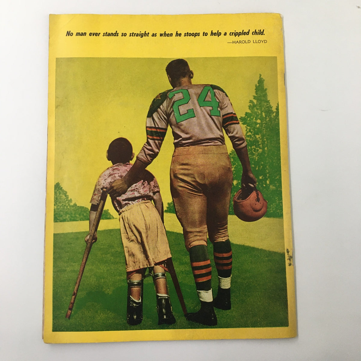 1956 NCAA 5th Annual Shrine Football Game and Pageant Souvenir Program cover illustration showcasing a football player helping a child, with the quote by Harold Lloyd.