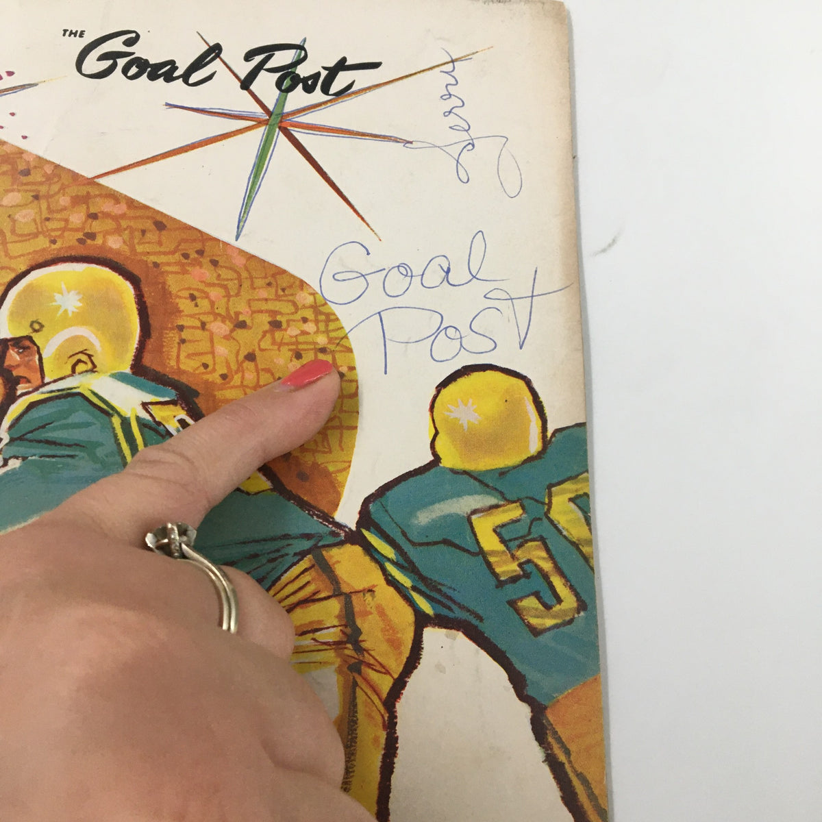 Close-up view of the October 17 1959 NCAA Football booklet cover showing handwritten notes, titled 'Goal Post'.