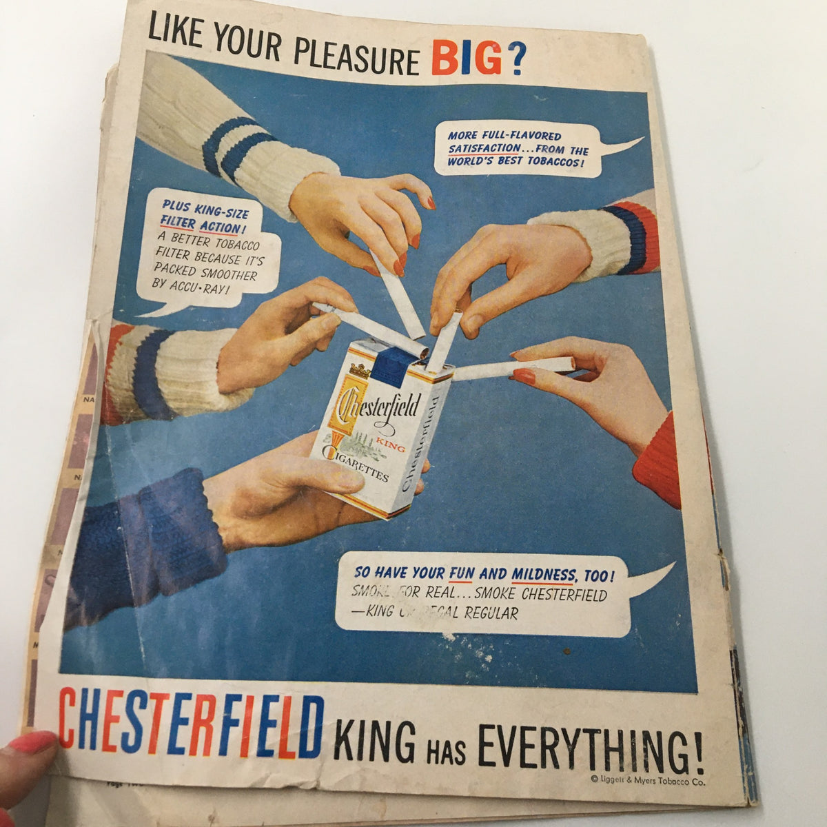 Vintage advertisement for Chesterfield cigarettes promoting smooth flavor and satisfaction, found in the official program for the November 2, 1957 NCAA Football game California vs UCLA.