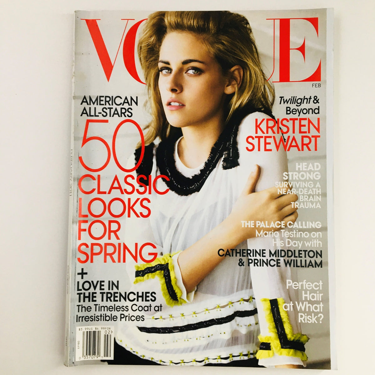 Vogue Magazine February 2011 cover featuring American actress Kristen Stewart. The cover highlights Kristen Stewart with styled hair and a fashionable outfit, along with a feature on classic spring looks and the Twilight saga. Ideal for collectors of vintage magazines.
