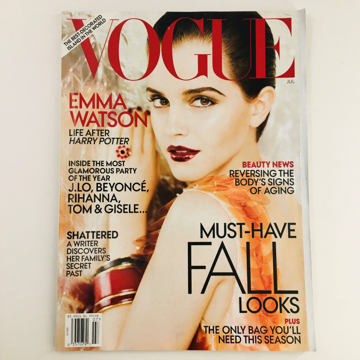 Vogue Magazine July 2011 cover featuring English actress Emma Watson, showcasing beauty and fashion trends.