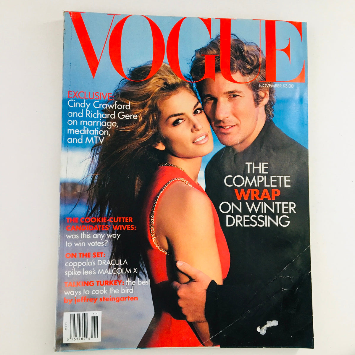 Cover of Vogue Magazine November 1992 featuring Cindy Crawford and Richard Gere, showcasing fashion trends with a bold red dress and winter dressing guide.