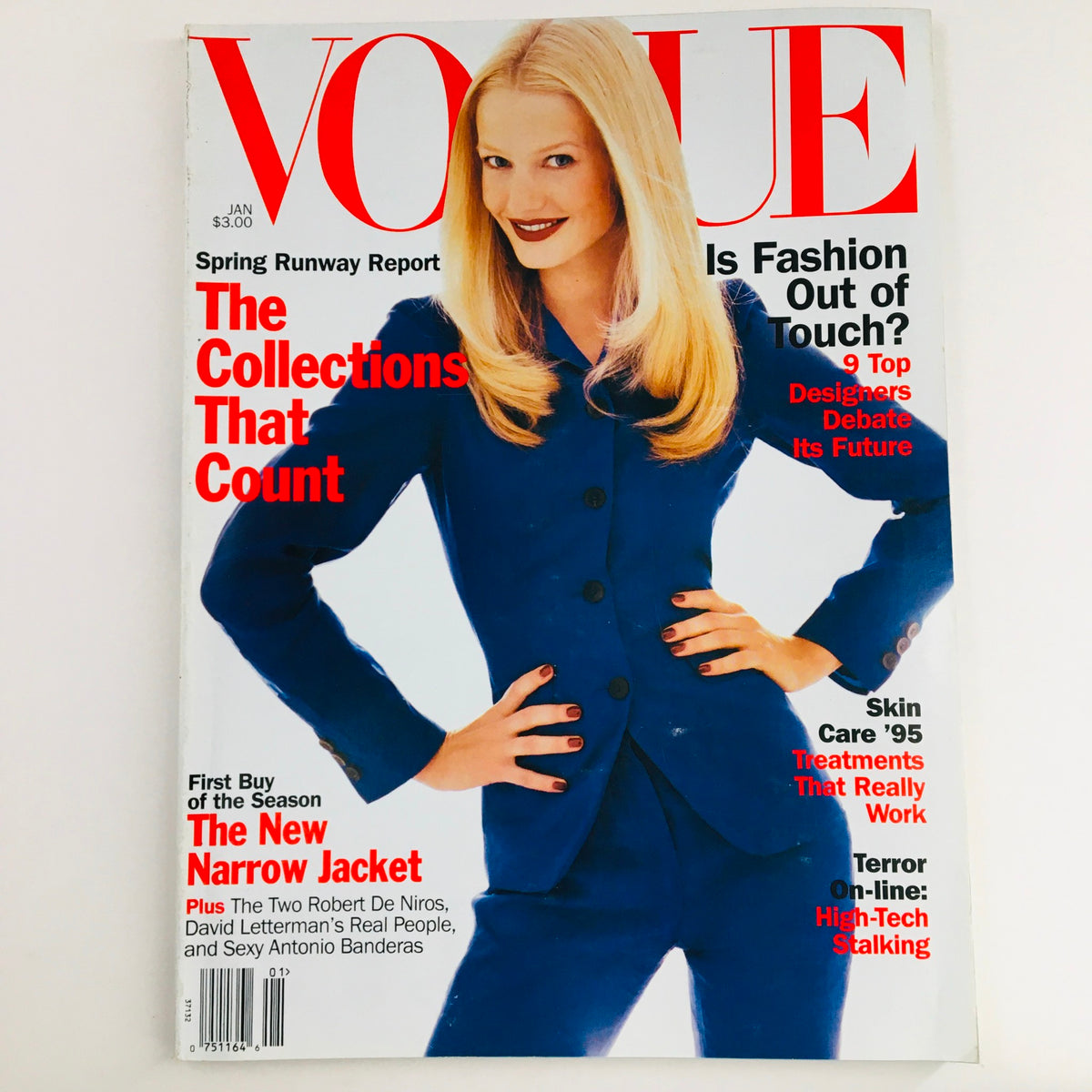 Vogue Magazine January 1995 cover featuring Dutch model and singer Karen Mulder in a blue suit, showcasing fashion trends of the 1990s.