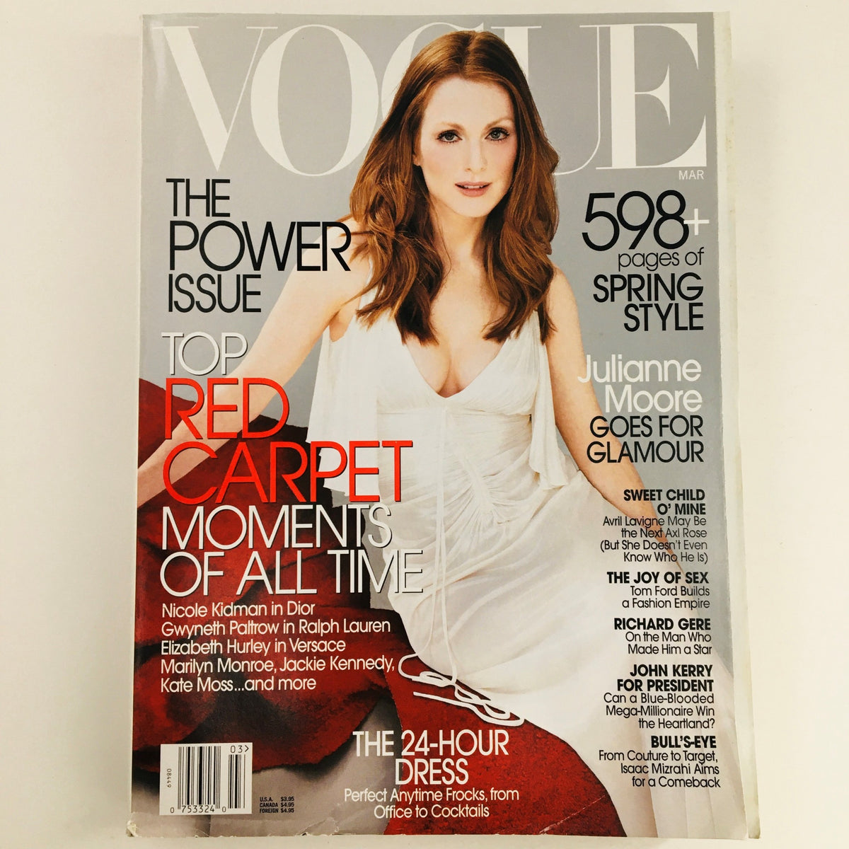Vogue Magazine March 2003 featuring American actress Julianne Moore on the cover, highlighting her beauty and capturing the essence of 2003 fashion trends.