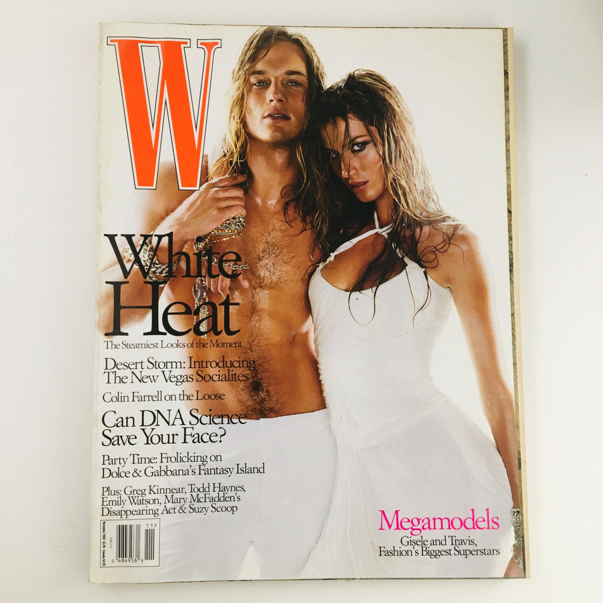 W Magazine November 2002 cover featuring models Travis Fimmel and Gisele Bündchen, showcasing iconic fashion from the early 2000s.