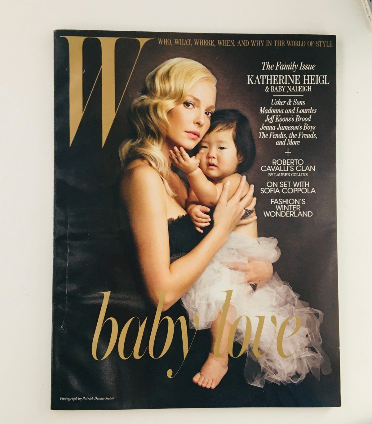 W Magazine December 2010 cover featuring American actress Katherine Heigl in 'Baby Love' editorial, showcasing her with a child, highlighting vintage fashion and photography.