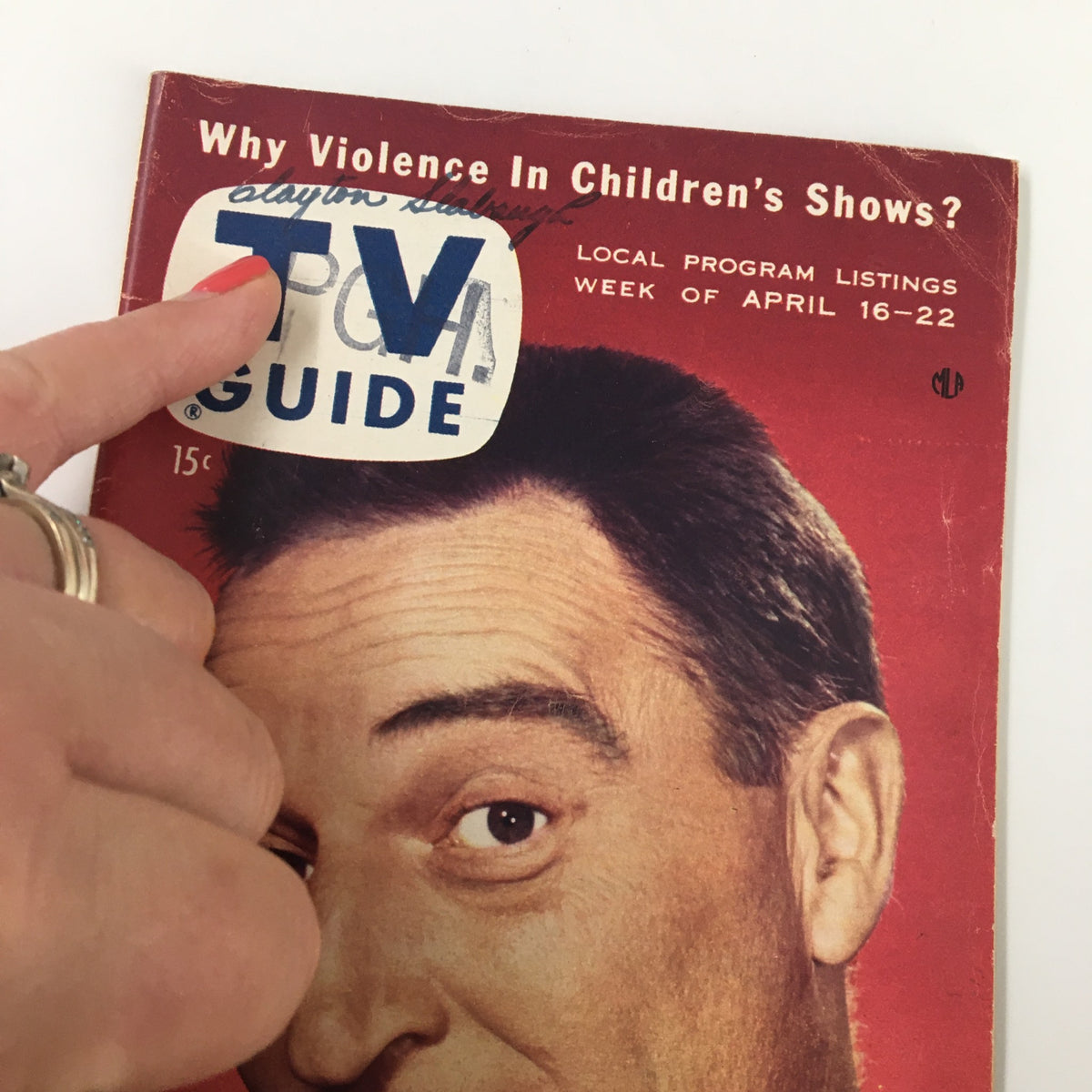 Close-up of the TV Guide Magazine April 16, 1955 cover, showcasing Gary Moore with a price tag and details of the magazine's content.
