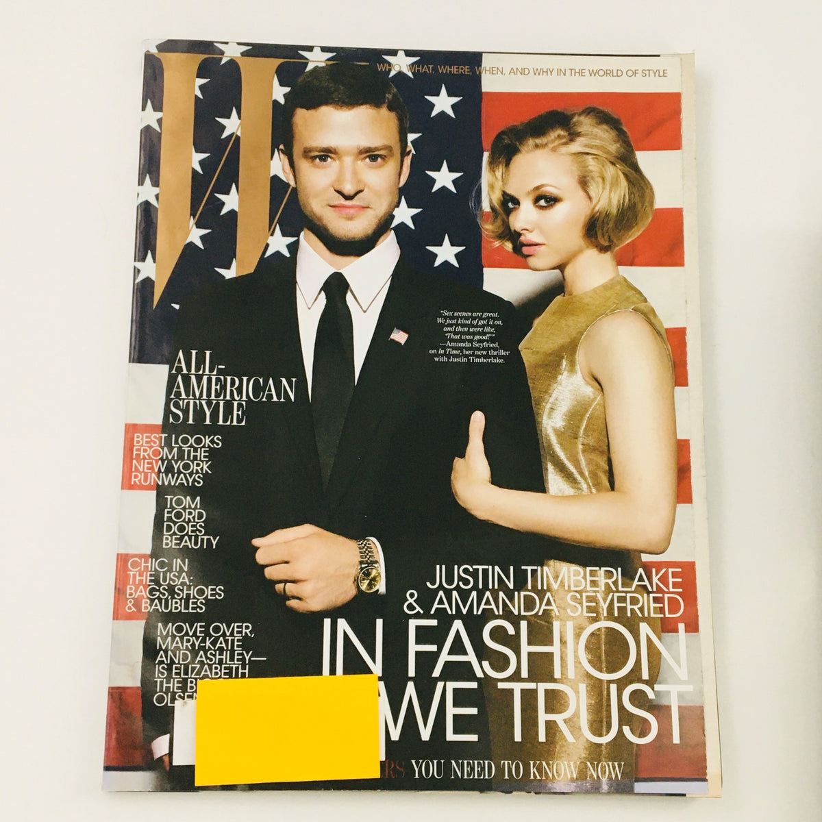 W Magazine October 2011 cover featuring Justin Timberlake and Mila Kunis in an All-American style, set against a backdrop of the American flag.