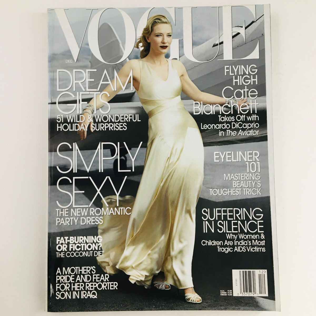 Vogue Magazine December 2004 featuring Australian Actor Cate Blanchett on the cover, showcasing a stunning fashion moment with a predominantly white dress and elegant styling.