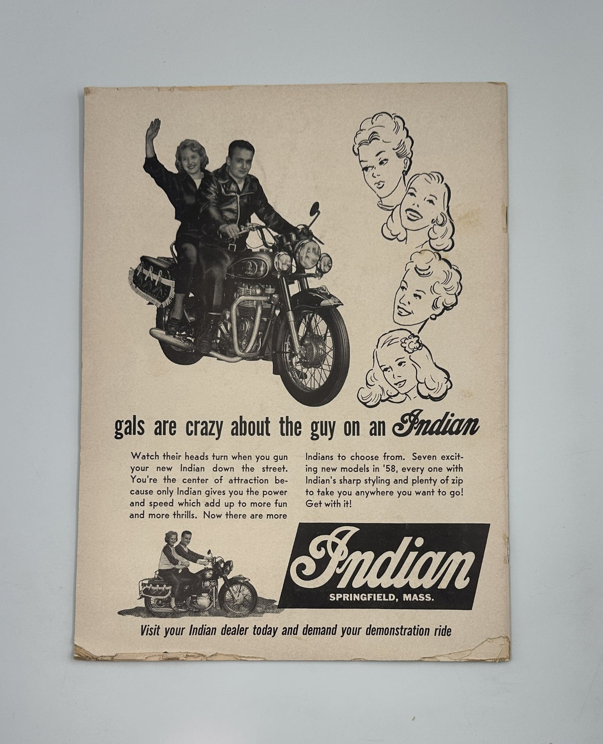 Cycle Magazine December 1957 featuring an advertisement for Indian motorcycles showcasing a couple riding together, designed to attract attention with a vibrant layout and images of the latest bike models.