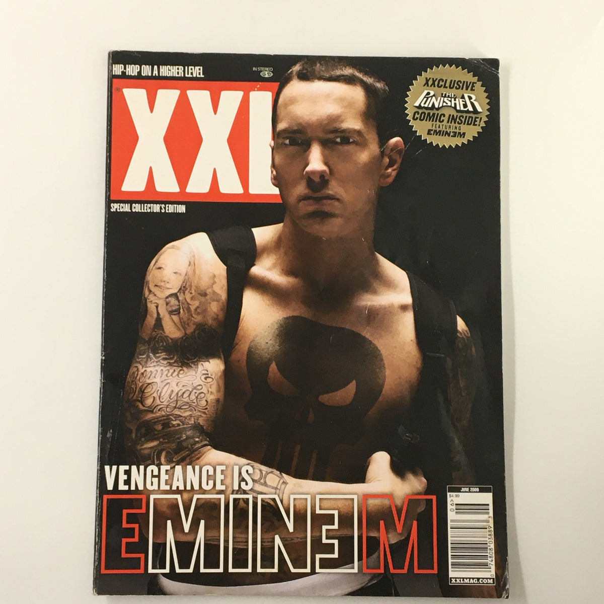 XXL Magazine, June 2009: Eminem featured with The Punisher, highlighting vengeance, comics, and music insights.