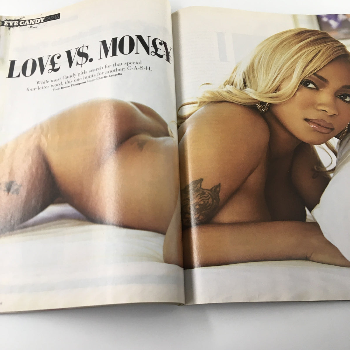 Stylized image from XXL Magazine June 2009 depicting a model in a provocative pose for the 'Love vs. Money' segment, part of the magazine's diverse content.