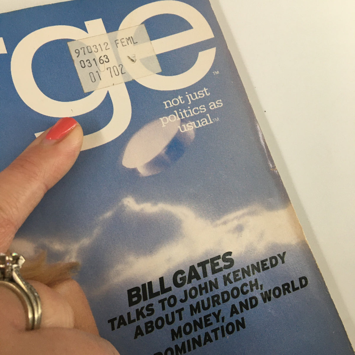 Cover of George Magazine February 1997 with Bill Gates, featuring a price sticker. A unique collectible reflecting the intersection of politics and celebrity.