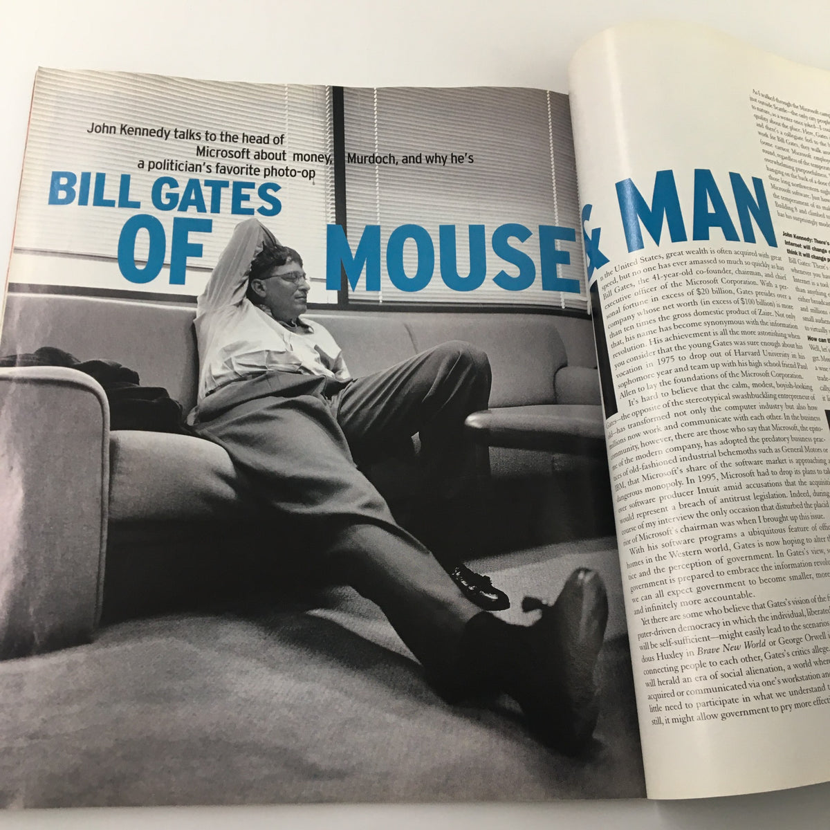 George Magazine February 1997 article featuring Bill Gates discussing tech and politics, showcasing his candid moment sitting on a couch.
