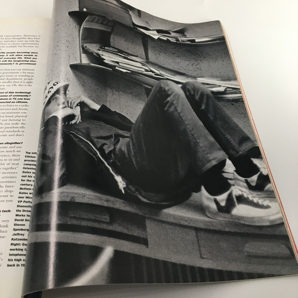 Black and white photo from George Magazine February 1997 depicting Bill Gates relaxed, symbolizing the intersection of business and politics.