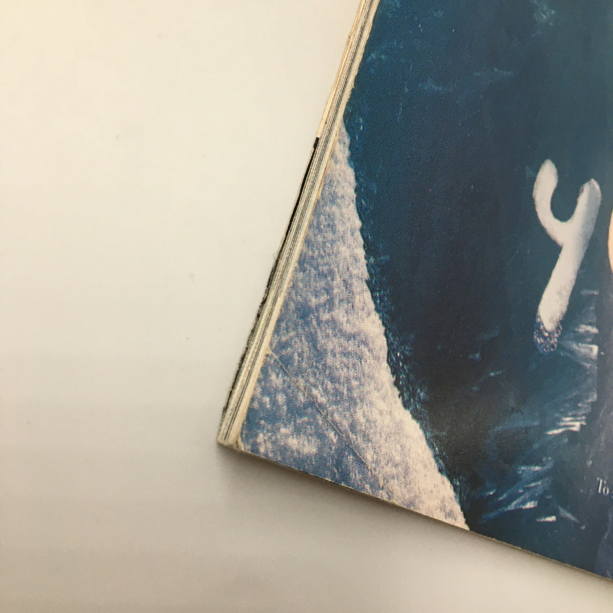 Close-up of the corner of George Magazine February 1997, highlighting the age and condition of the publication, an essential piece for vintage magazine collectors.