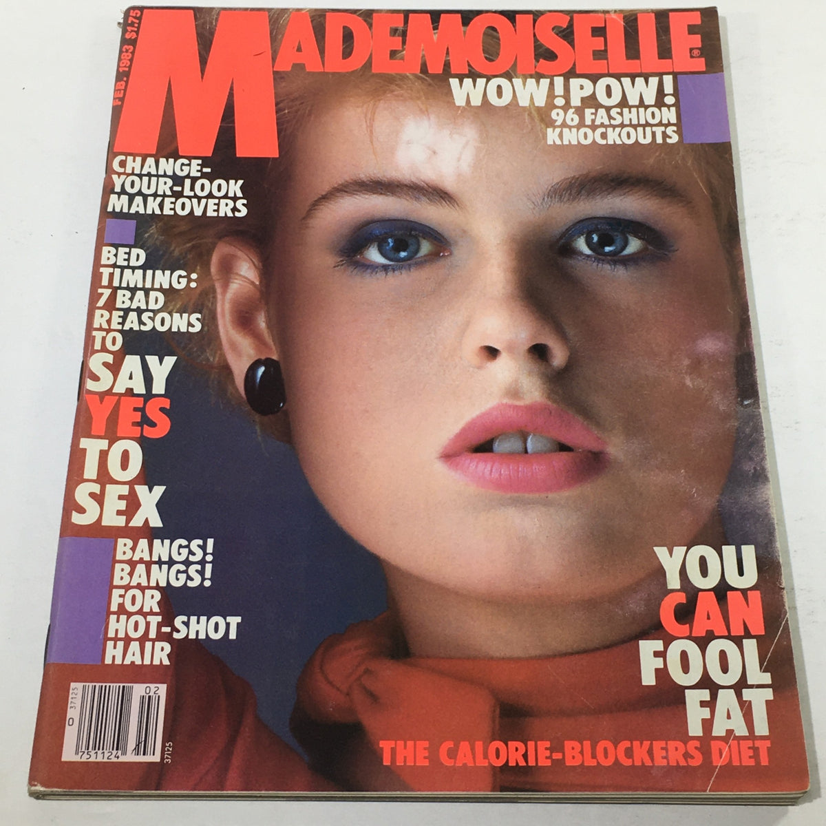 Cover of VTG Mademoiselle Magazine: February 1983 featuring a model with bold makeup and styled hair, showcasing fashion trends of the early 1980s.