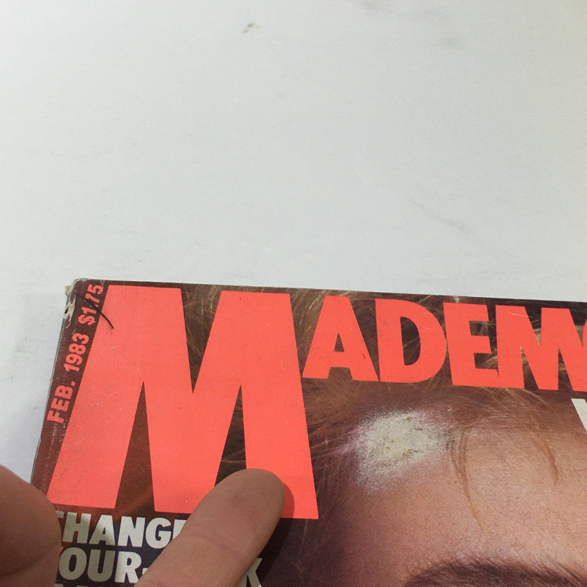 Close-up of the cover of VTG Mademoiselle Magazine: February 1983 featuring dramatic typography and a vintage aesthetic.