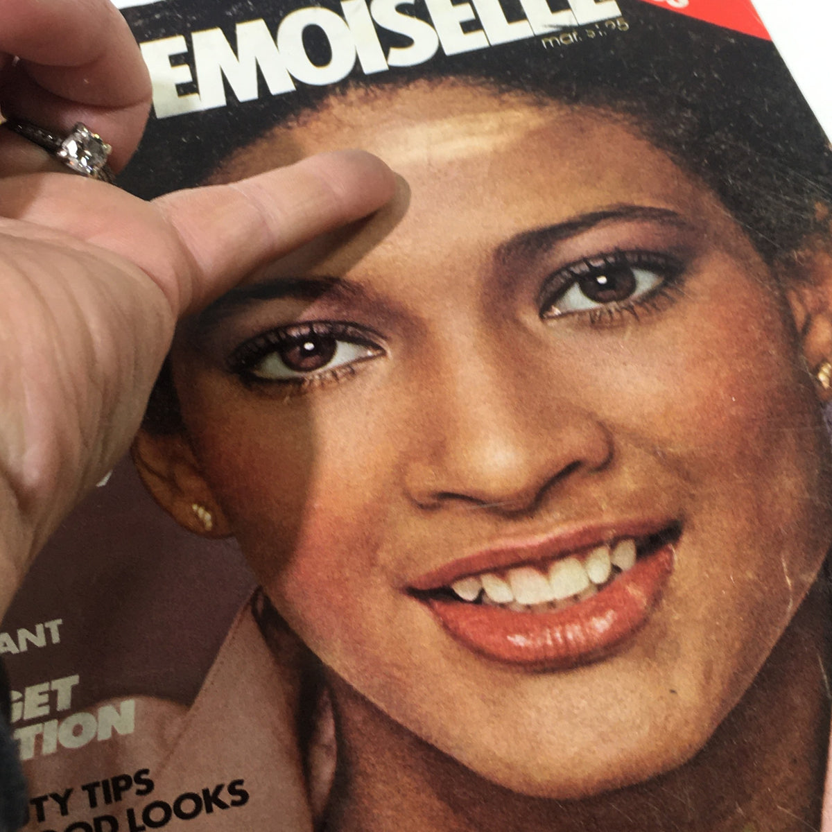 Close-up view of the cover of VTG Mademoiselle Magazine: March 1978, highlighting Peggy Dillard's radiant smile and beauty, with a focus on the magazine's title and featured articles.