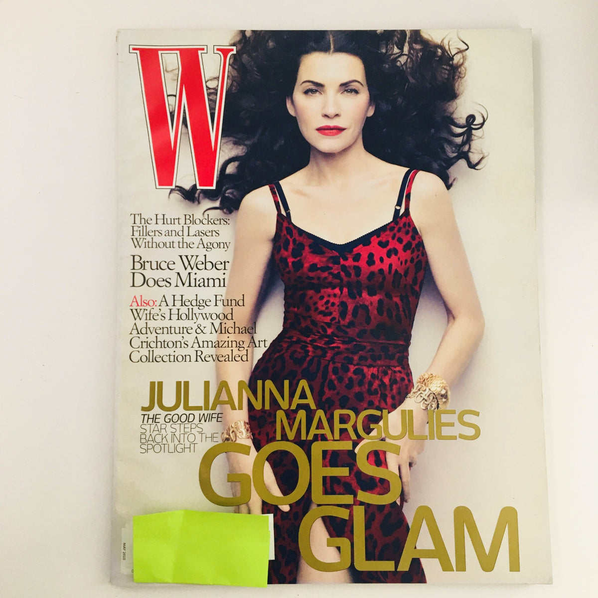 Cover of W Magazine May 2010 featuring American actress Julianna Margulies in a striking outfit, highlighting the title 'Julianna Margulies Goes Glam'. This vintage issue captures Margulies' presence in contemporary cinema.
