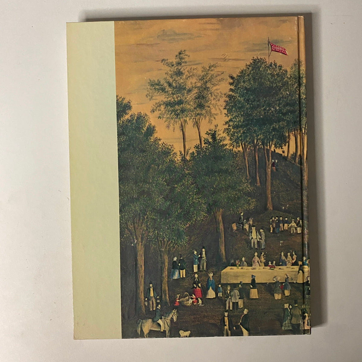 Back cover of Art in America Magazine No. 4 1963 displaying a picnic scene with people, trees, and a peaceful landscape.