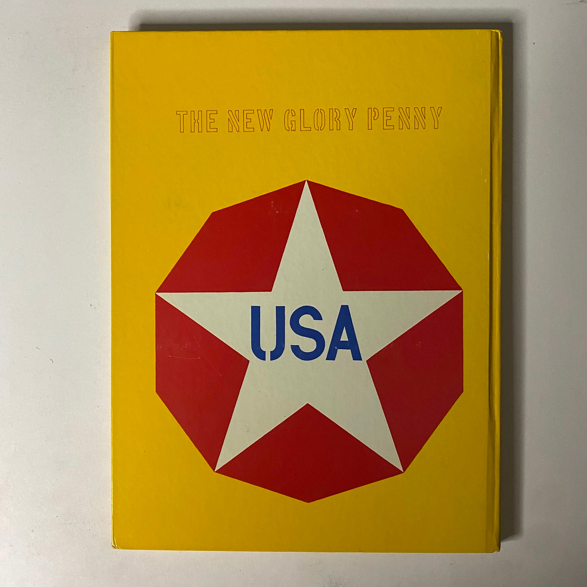 Back cover of Art in America Magazine No. 2 1963, displaying The New Glory Penny design with a red star and USA text against a yellow background.