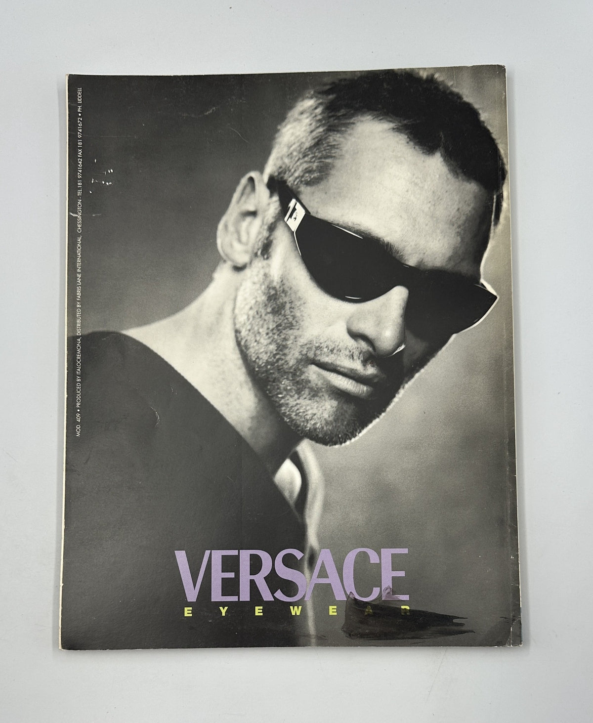 Cover of Wallpaper Magazine March/April 1997 featuring Versace Eyewear, depicting a model wearing sunglasses with a stylish and contemporary aesthetic.