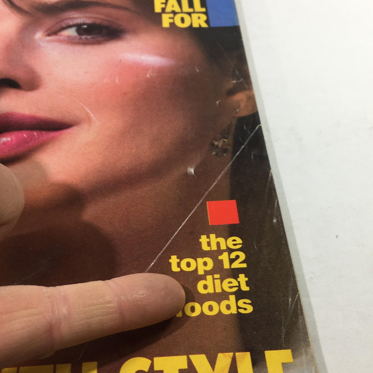 Detail of Mademoiselle Magazine: September 1982 cover, focusing on a fashion article about diet foods and styling tips, with model's face prominently displayed.