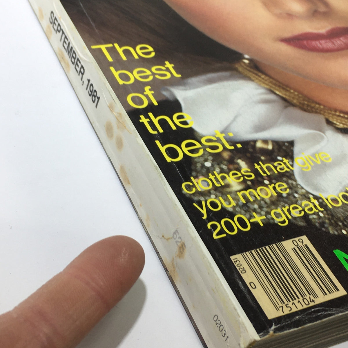 Close-up side view of VTG Vogue Magazine September 1981 displaying the spine and edge wear, highlighting its vintage condition.