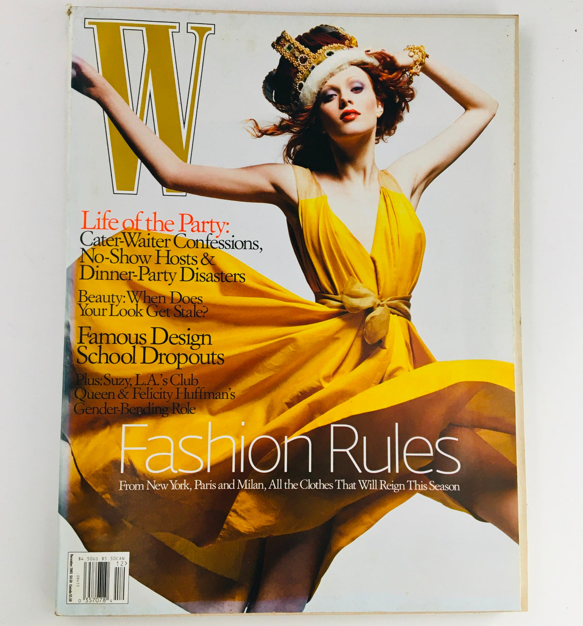 W Magazine December 2005 featuring model Karen Elson in a striking yellow dress and crown, highlighting fashion trends and editorial photography from the mid-2000s.