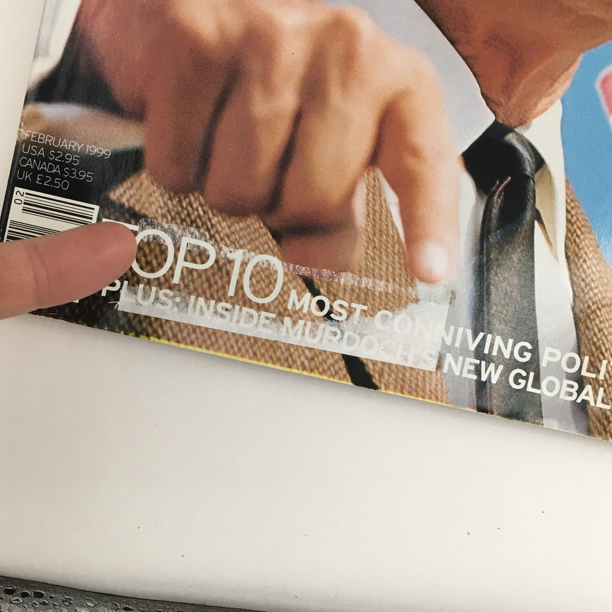 Close-up of the George Magazine February 1999 cover with Ronald Reagan's hand pointing, featuring the text 'TOP 10 Most Conniving Politicians'.