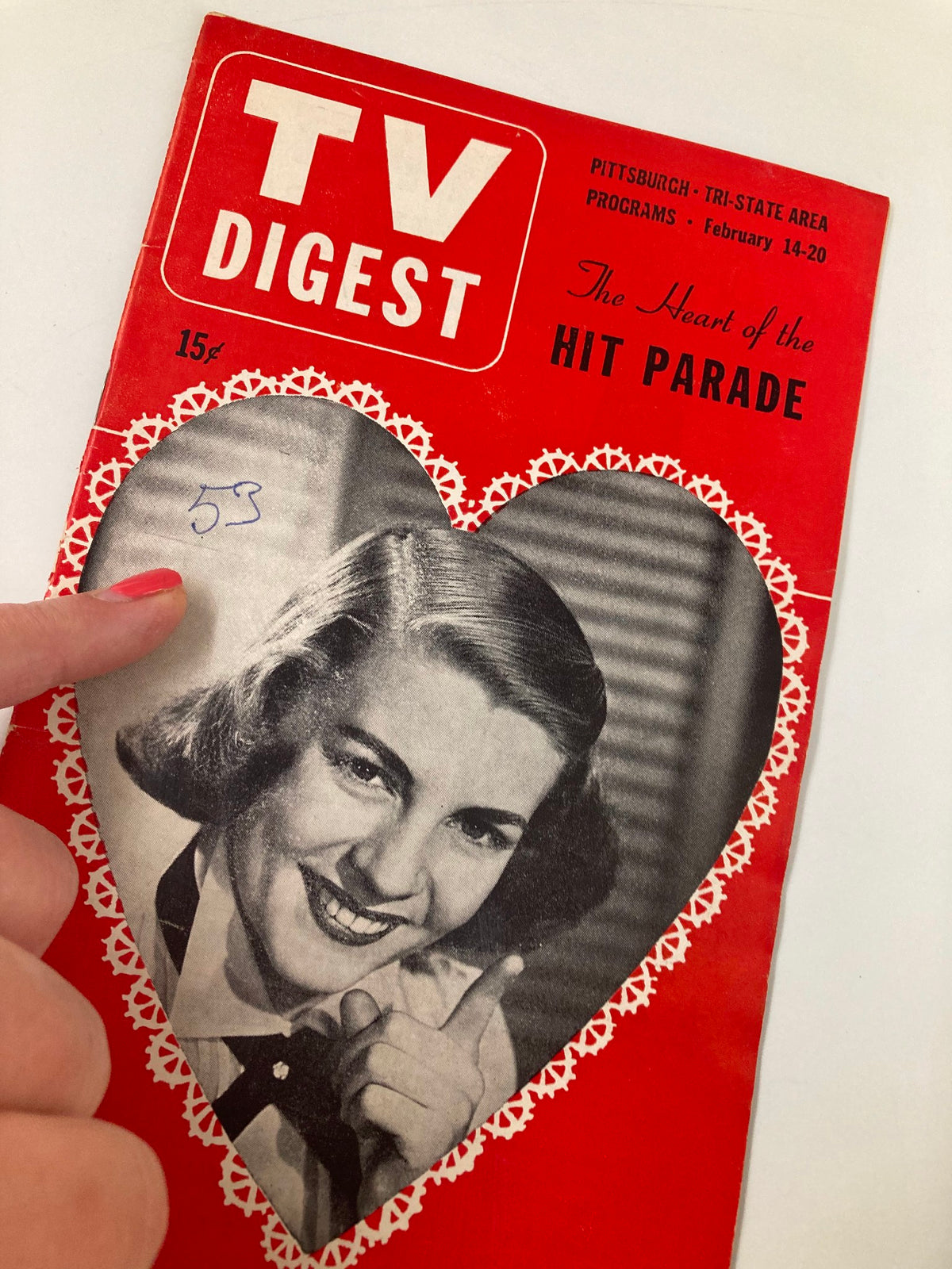 Close-up of the TV Digest Magazine February 14 1953 cover, showing a woman smiling and the magazine's title 'TV DIGEST' with decoration, emphasizing its nostalgic value.
